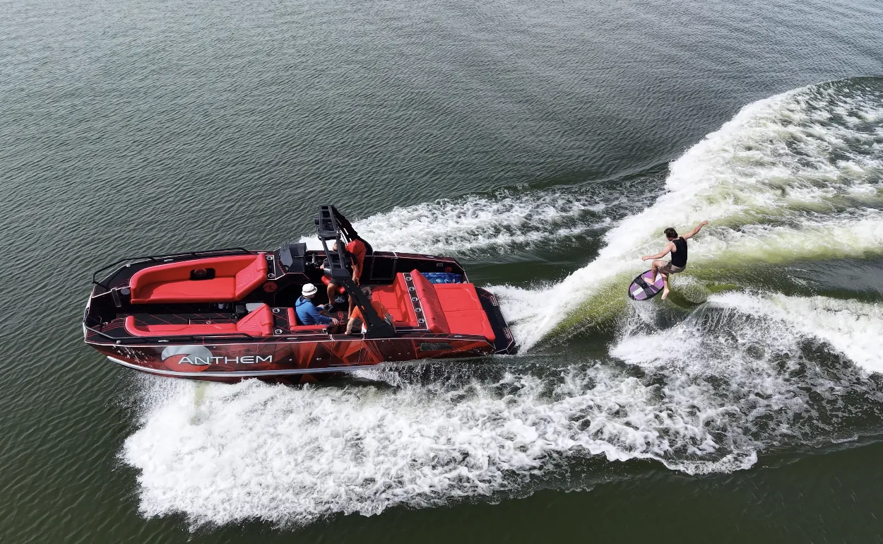 Assault XR23 and a rider alongside its wake