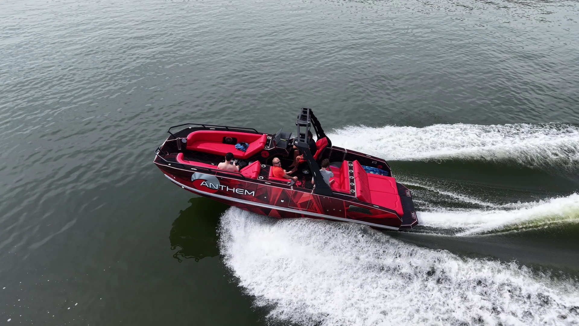 Red Anthem boat running across the lake