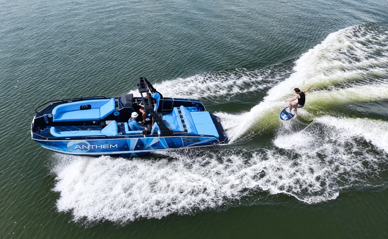 Baby-blue Assault XR23 beside a wakesurfer
